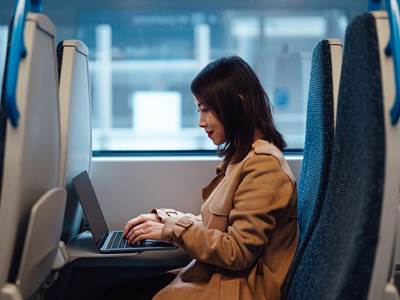 Woman Laptop Train Thumbnail